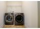 A convenient laundry room equipped with modern appliances at 1076 Scenic Park Trl, Lawrenceville, GA 30046