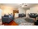 Open-concept living room with hardwood floors and connection to the kitchen and dining area at 1076 Scenic Park Trl, Lawrenceville, GA 30046