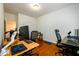 Spacious office features two desks, hardwood floors, and neutral walls offering a productive work environment at 1076 Scenic Park Trl, Lawrenceville, GA 30046