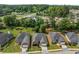 Aerial view of homes with manicured lawns and tree-lined streets in a well-maintained neighborhood at 115 Pinnacle Ln, Mcdonough, GA 30253