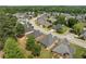 Aerial view showcases the neatly arranged homes and tree-lined streets in a well-maintained community at 115 Pinnacle Ln, Mcdonough, GA 30253