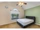 This bedroom features a large window, ceiling fan, and neutral wall color at 115 Pinnacle Ln, Mcdonough, GA 30253