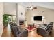 Spacious living room featuring a fireplace, high ceilings, and comfortable seating at 115 Pinnacle Ln, Mcdonough, GA 30253
