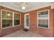 Covered back porch with ceiling fan and access to the backyard at 115 Pinnacle Ln, Mcdonough, GA 30253