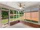 Screened in porch with ceiling fan and view of the backyard at 115 Pinnacle Ln, Mcdonough, GA 30253