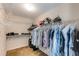 Walk-in closet with ample storage space for clothing, shoes, and accessories, enhancing organization at 115 Pinnacle Ln, Mcdonough, GA 30253