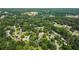 Picturesque aerial shot of a residential neighborhood with tree-lined streets and well-maintained homes at 385 Stonebridge Trl, Roswell, GA 30075