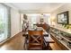 Dining room with wood table and bench seating with hardwood flooring at 385 Stonebridge Trl, Roswell, GA 30075