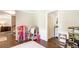 Open hallway showcases hardwood floors, neutral paint, and plenty of space for play at 385 Stonebridge Trl, Roswell, GA 30075