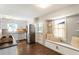 Updated kitchen boasts modern appliances, granite countertops, and a charming window seat with natural light at 385 Stonebridge Trl, Roswell, GA 30075