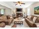 Inviting living room with brick fireplace and comfortable, coordinating furniture at 385 Stonebridge Trl, Roswell, GA 30075