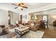 Comfortable living room with plush seating, hardwood floors, and open layout at 385 Stonebridge Trl, Roswell, GA 30075