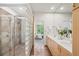 Sleek bathroom features glass enclosed shower and double vanity, offering space and style at 1344 Fernwood Ne Cir, Brookhaven, GA 30319