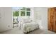 Cozy bedroom bathed in natural light, featuring a large window and minimalist decor at 1344 Fernwood Ne Cir, Brookhaven, GA 30319