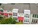 Charming townhome with eye-catching red awnings, modern style and lush landscaping at 1344 Fernwood Ne Cir, Brookhaven, GA 30319
