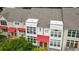 Modern townhome exterior featuring a red awning, large windows, and well-maintained facade at 1344 Fernwood Ne Cir, Brookhaven, GA 30319