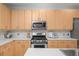 Well-appointed kitchen with ample cabinet space and modern appliances, perfect for cooking and entertaining at 1344 Fernwood Ne Cir, Brookhaven, GA 30319