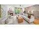 Living room features fireplace, natural light, brick accent wall, wood flooring, and modern decor at 1344 Fernwood Ne Cir, Brookhaven, GA 30319