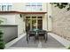 Outdoor patio with dining set, and lush landscaping at 1344 Fernwood Ne Cir, Brookhaven, GA 30319