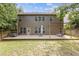 Lush backyard with outdoor deck perfect for entertainment or relaxation, offering ample space at 224 Farm Manor Ct, Lawrenceville, GA 30045