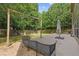 Outdoor deck perfect for entertaining with wooded backyard and seating for guests at 224 Farm Manor Ct, Lawrenceville, GA 30045
