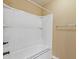 The bathroom features a tub and shower combination with a white surround and decorative black and gray striping at 224 Farm Manor Ct, Lawrenceville, GA 30045