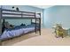 ' bedroom with blue walls features a bunk bed and a desk with a green chair at 224 Farm Manor Ct, Lawrenceville, GA 30045