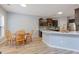 Bright kitchen with island, stainless appliances, and a breakfast table by the window at 224 Farm Manor Ct, Lawrenceville, GA 30045