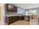 Open kitchen features stainless steel appliances, custom cabinetry, and eat-in breakfast area at 224 Farm Manor Ct, Lawrenceville, GA 30045