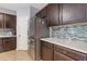 Kitchen includes stainless fridge, white counters, and modern backsplash at 224 Farm Manor Ct, Lawrenceville, GA 30045