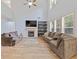 Spacious living area features a fireplace, built-in shelves, and lots of natural light at 224 Farm Manor Ct, Lawrenceville, GA 30045
