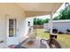 Outdoor back porch with room for seating, leading to the fenced backyard at 255 Webster Lake Dr, Temple, GA 30179