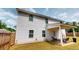 Enjoy the backyard with a covered patio and chairs, perfect for outdoor relaxation at 255 Webster Lake Dr, Temple, GA 30179