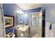Bright bathroom with a vanity, sink and view into the hallway at 255 Webster Lake Dr, Temple, GA 30179