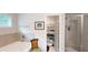 Relaxing bathroom with a tub, shower, and linen closet at 255 Webster Lake Dr, Temple, GA 30179