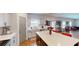 The kitchen features an island with seating, stainless steel appliances, and tile backsplash at 255 Webster Lake Dr, Temple, GA 30179