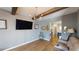 Living room boasts hardwood floors, modern lighting fixtures, and a view into the adjacent kitchen at 255 Webster Lake Dr, Temple, GA 30179