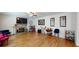 Spacious living room boasts a stone fireplace, hardwood floors, and ample natural light at 255 Webster Lake Dr, Temple, GA 30179