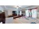 Open main bedroom boasting ample space, a ceiling fan, and natural lighting at 255 Webster Lake Dr, Temple, GA 30179