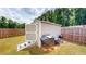 The backyard features a useful storage shed with a double door entrance and a grill nearby at 255 Webster Lake Dr, Temple, GA 30179