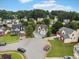 Aerial view of a beautiful home on a corner lot with lush landscaping in a Gathering-friendly neighborhood at 3042 Oak Vista Way, Lawrenceville, GA 30044