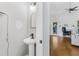 Modern half-bathroom featuring hardwood floors and contemporary fixtures at 3042 Oak Vista Way, Lawrenceville, GA 30044