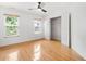 Bright bedroom with hardwood floors, a ceiling fan, and a closet at 3042 Oak Vista Way, Lawrenceville, GA 30044