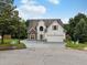 Charming two-story home with stone accents, attached two-car garage and well-maintained landscaping at 3042 Oak Vista Way, Lawrenceville, GA 30044