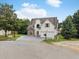 Charming two-story home with stone accents, attached two-car garage and well-maintained landscaping at 3042 Oak Vista Way, Lawrenceville, GA 30044