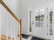 Close up of the front door with decorative glass inserts and sidelights from the foyer at 3042 Oak Vista Way, Lawrenceville, GA 30044