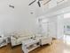 Open living room featuring vaulted ceiling, hardwood floors, and ample natural light at 3042 Oak Vista Way, Lawrenceville, GA 30044
