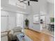 Bright and open living room with hardwood floors, clerestory ceiling and adjoining kitchen at 3042 Oak Vista Way, Lawrenceville, GA 30044
