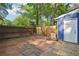 Private backyard with wooden fence, door to unit, and a mix of concrete and stone patio at 3799 Henry Ct, Acworth, GA 30101