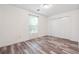 Cozy bedroom featuring modern floors, a window for natural light, and a closet for ample storage at 3799 Henry Ct, Acworth, GA 30101